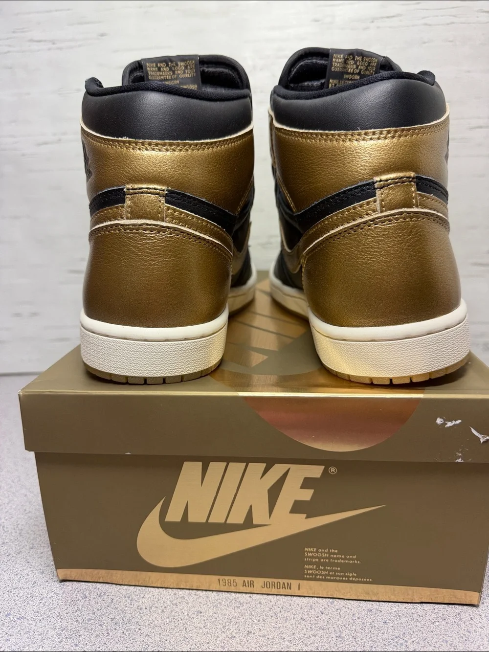 Jordan High-Top Sneakers in Black and Metallic Gold